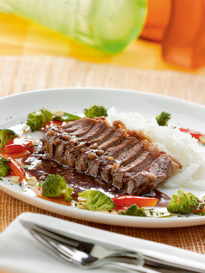 Langkawi Malaysian Rump steak with peanut sauce, vegetables, and coconut rice