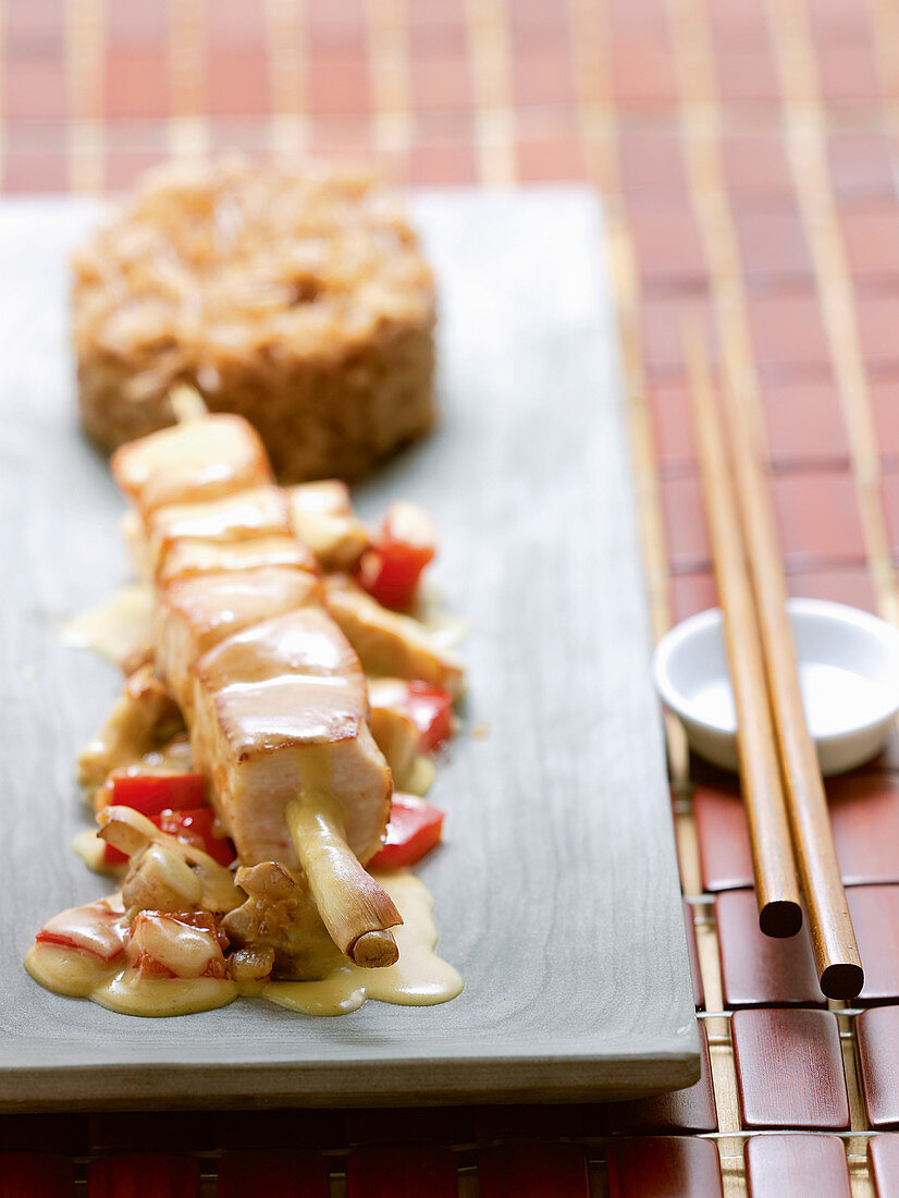 Thai chicken on lemongrass skewers with coconut curry vegetables