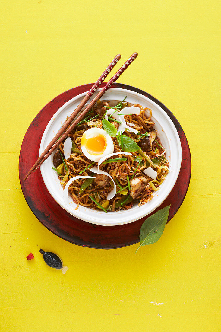 Fried coconut noodles with a soft-boiled egg