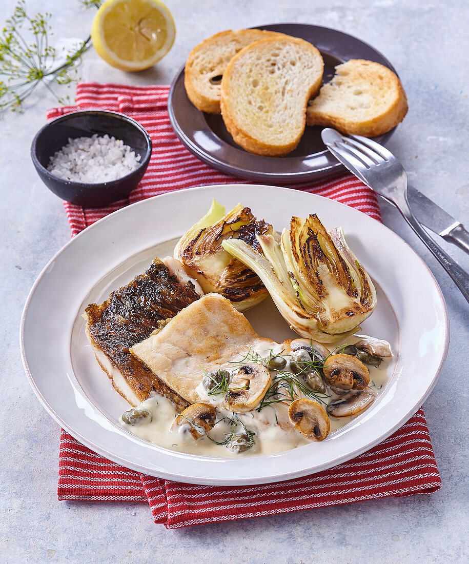 Carp with mushrooms in cream sauce