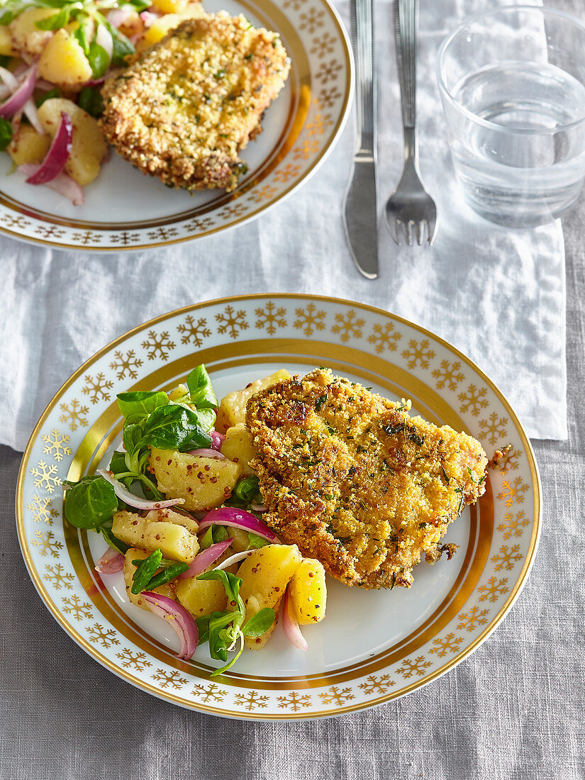 Carp in herb and cornflakes crust with potato salad