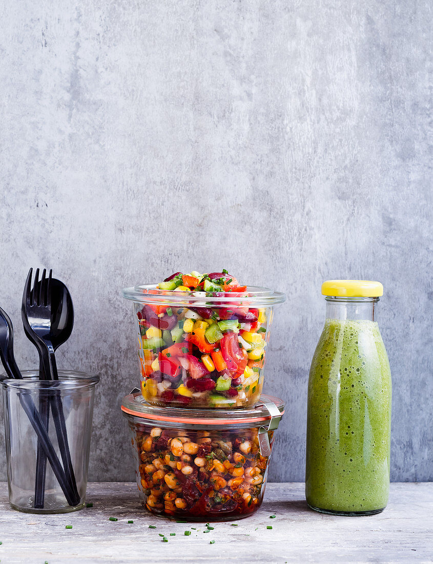 Vegan 'To Go' lunch of bean salad and chopped salad in a jar