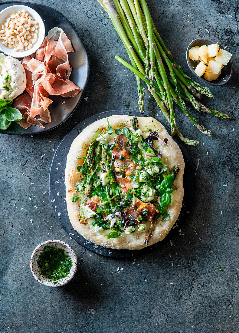 Asparagus pizza with buratta and prosciutto