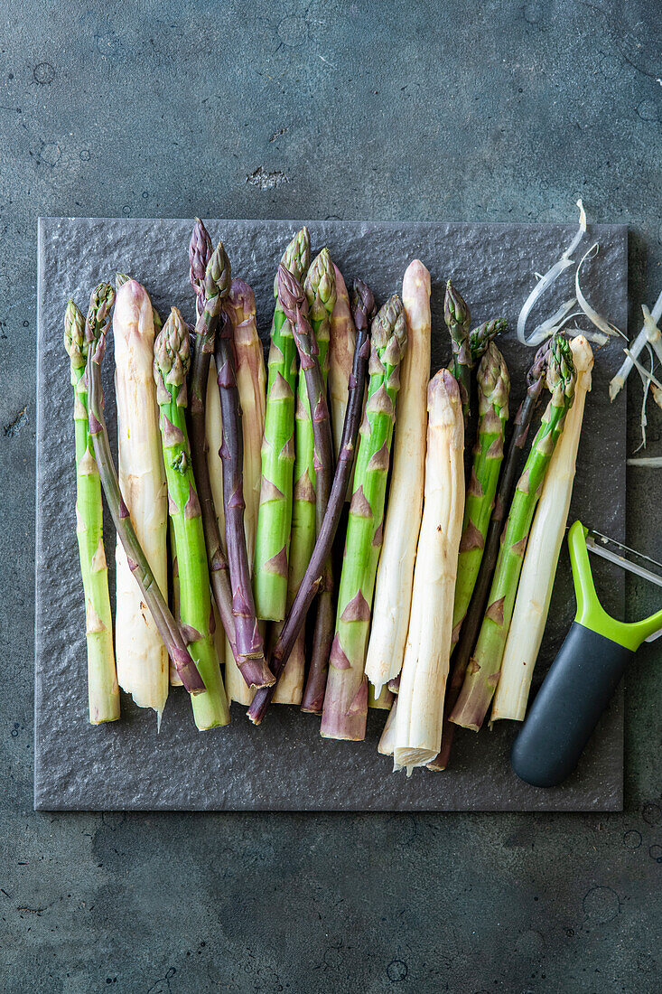 Fresh green, purple and white asparagus