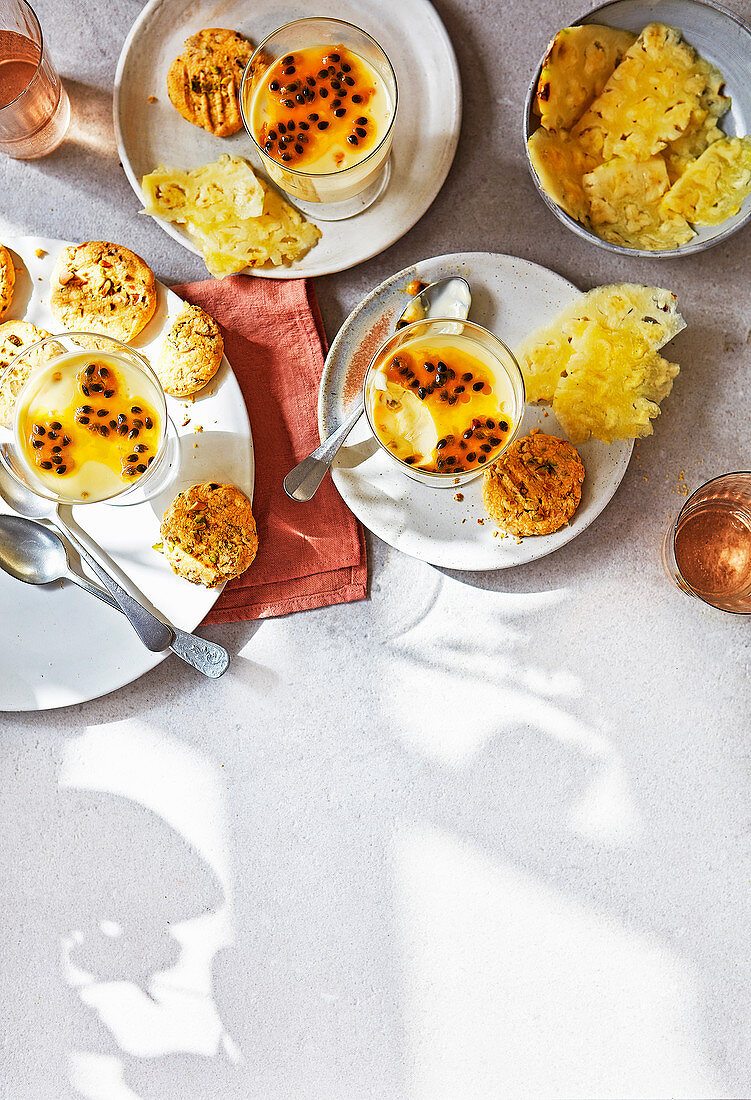 Passion fruit posset with pistachio-custard biscuits and fresh pineapple