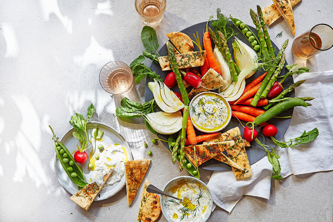 Summer vegetable and flatbread platter with dill and mustard dip