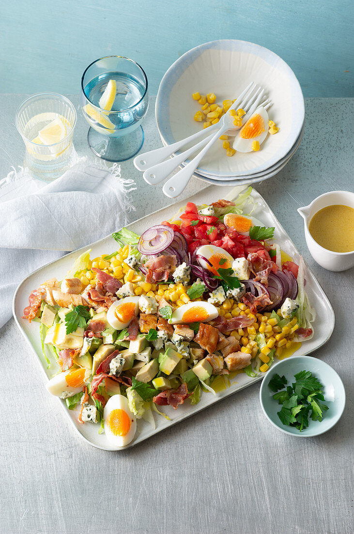 Cobb salad with eggs, bacon, chicken and blue cheese