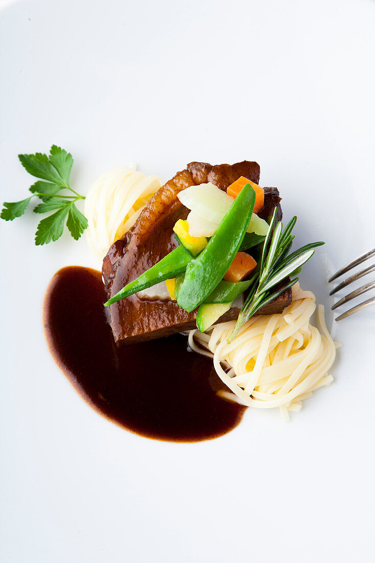 corned beef braised in Burgundy with fine vegetables and pasta