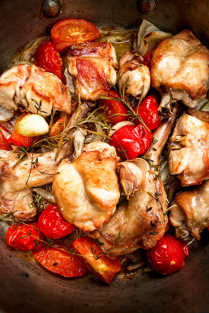 Rabbit pot roast with tomatoes and rosemary