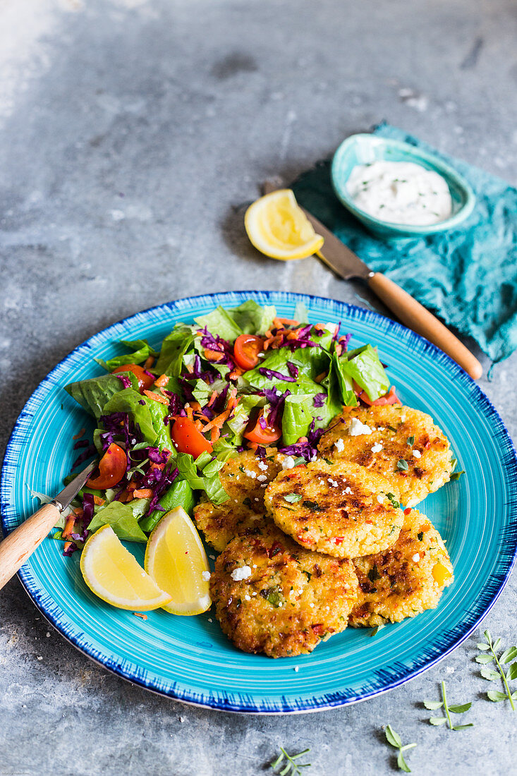 Quinoa cakes served with green salad