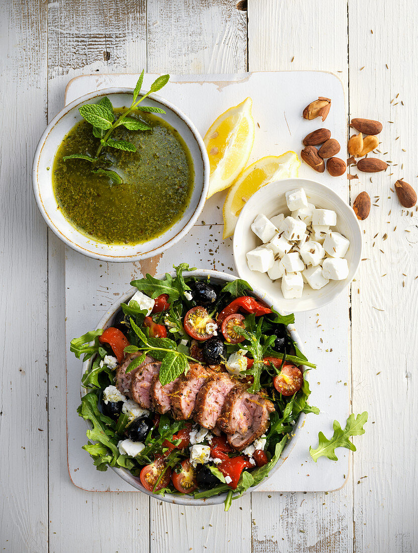 Mixed salad with olives, feta and fried pork tenderloin