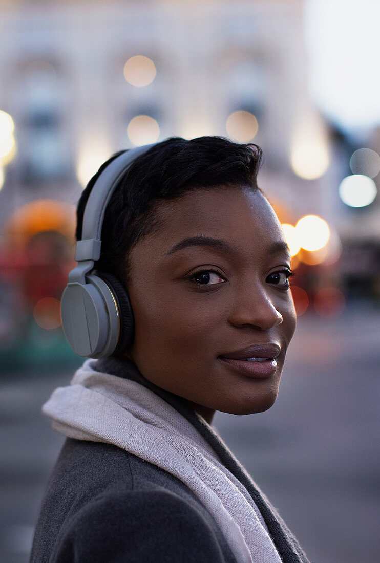 Confident young woman with headphones