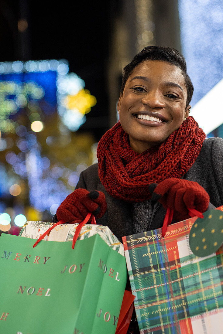 Happy young woman with Christmas shopping bags
