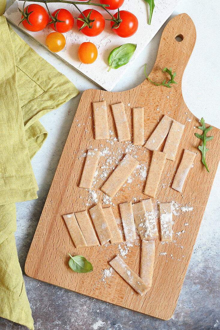 Homemade fresh pizzoccheri on a wooden board