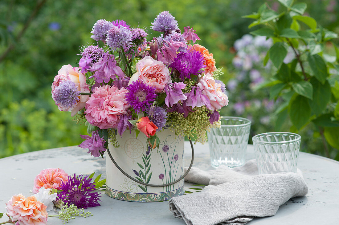 Early summer bouquet of roses, columbine, knapweed, chive blossoms, Caucasian crosswort and elderflower buds