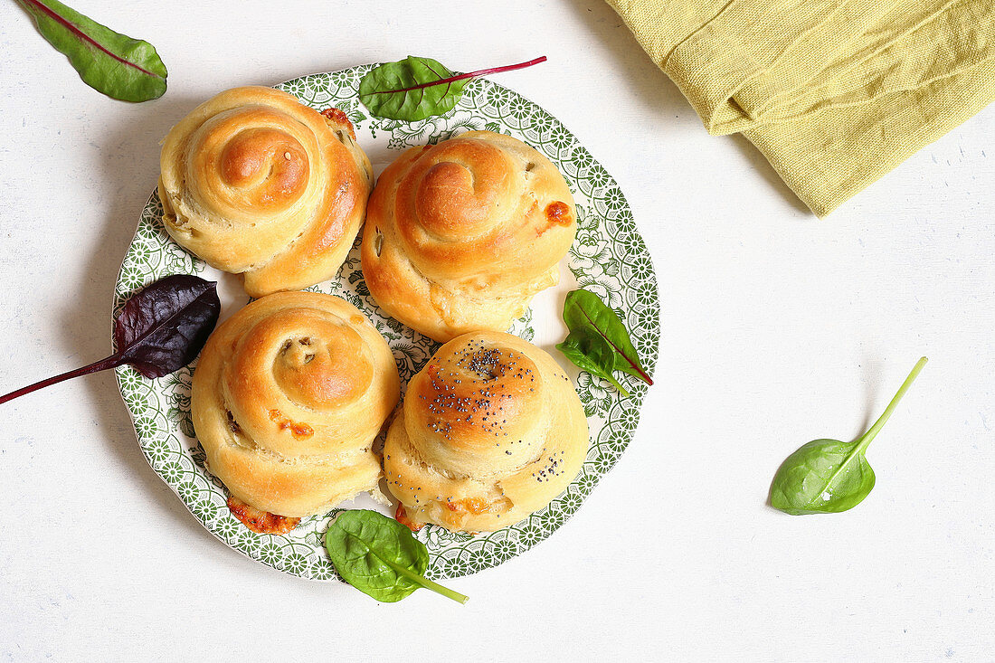 Hearty filled brioches with olives and provolone