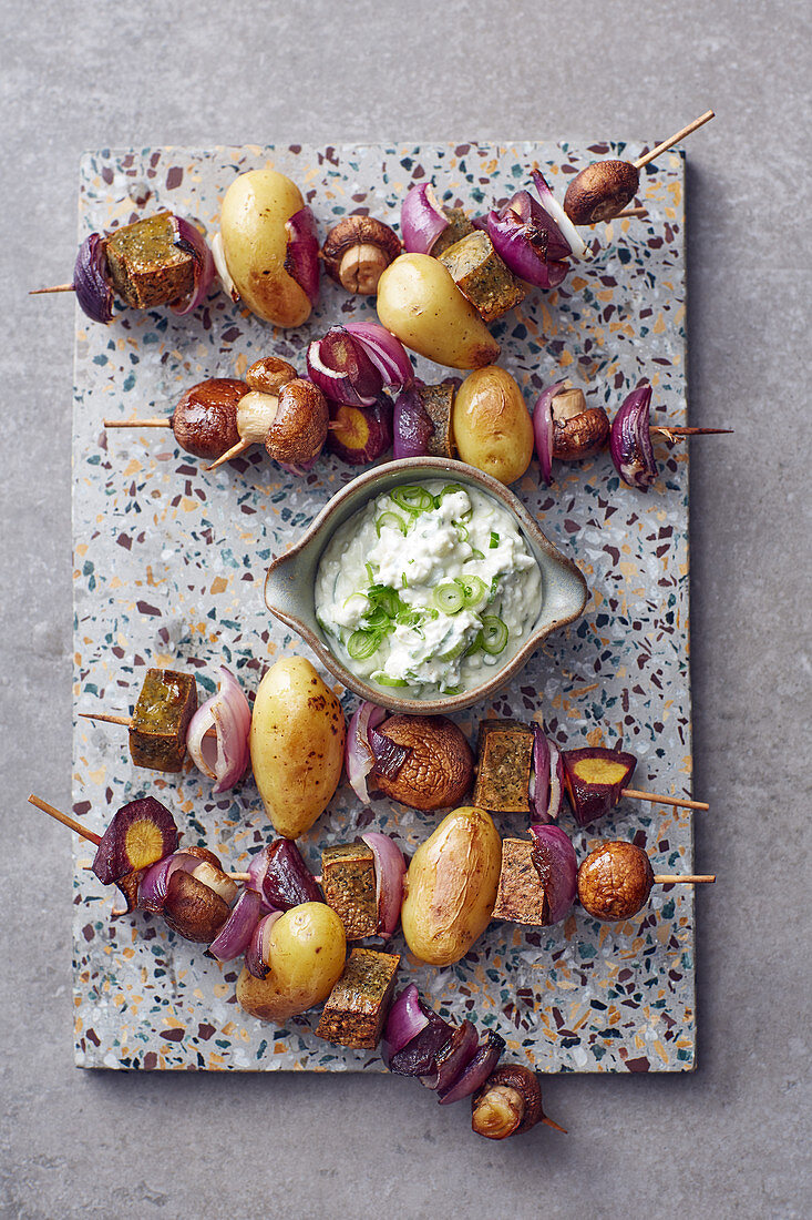 Potato and vegetable kebabs with a spring onion dip