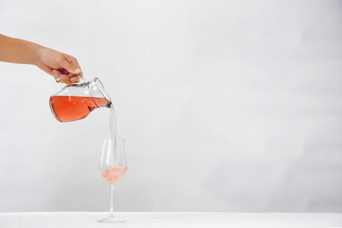 Pouring rosé wine