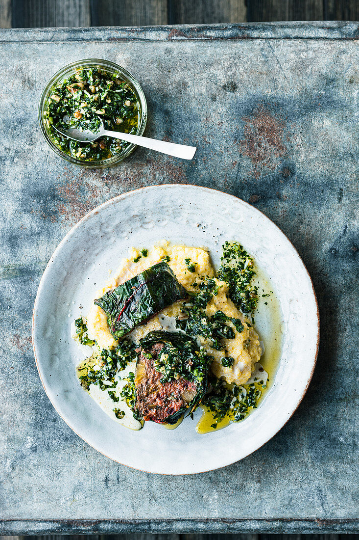 Chard roulade with a minced meat filling on a bed of polenta