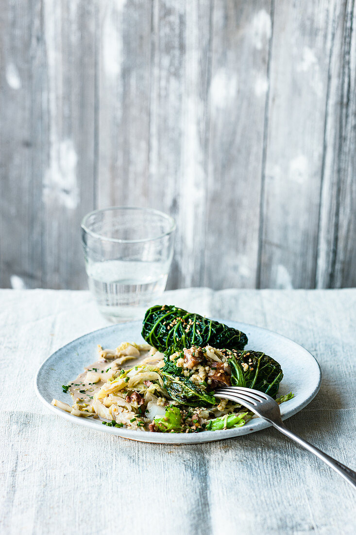 Savoy cabbage with pearl barley, raw sausage and Alpine cheese