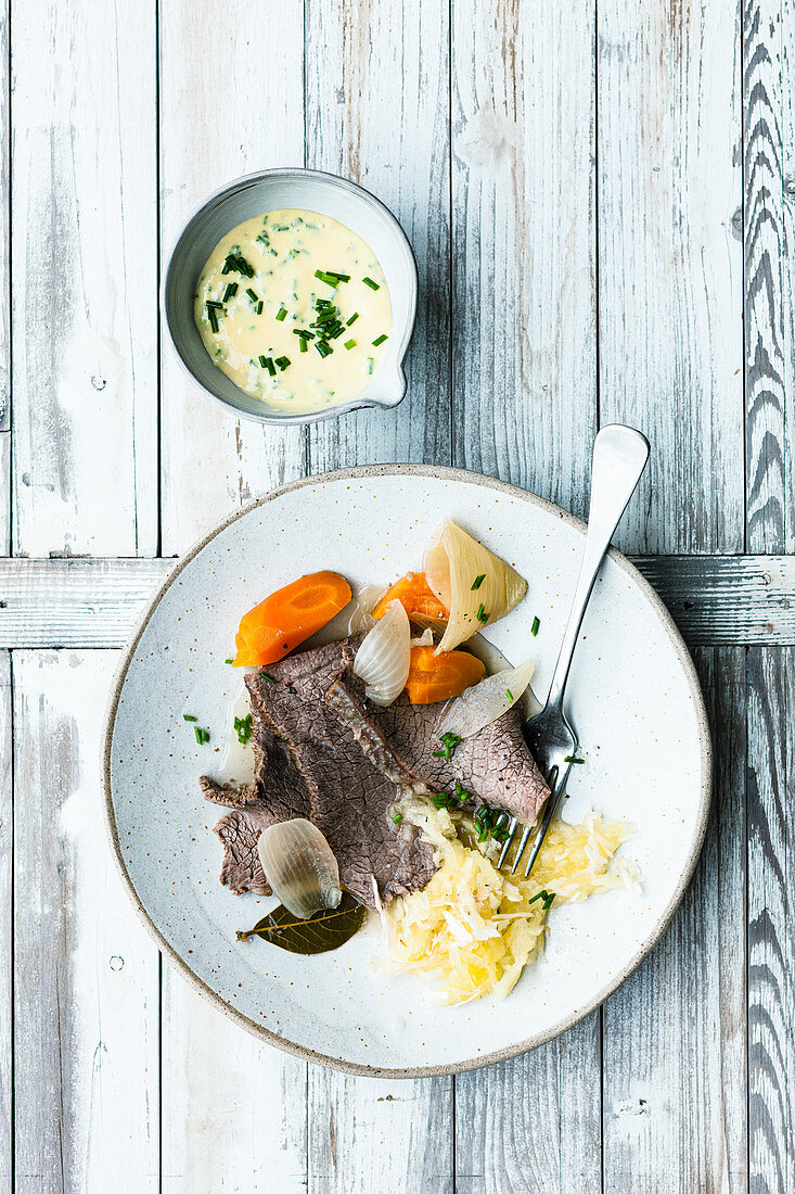 Close-up of boiled beef with apple horseradish on plate