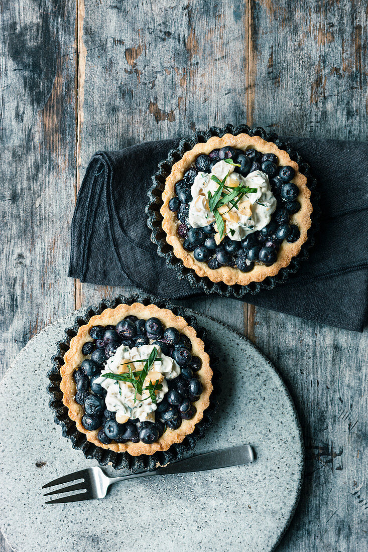Blueberry tartlets with creamy crunch and macadamia nuts