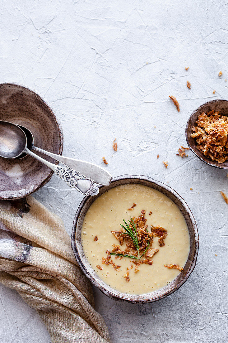 Creamy corn soup with roasted onion and rosemary