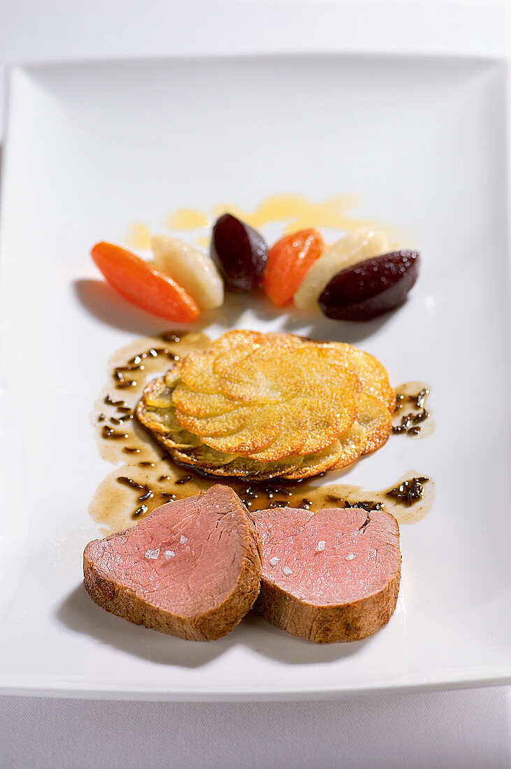 Pork fillet with beer and caraway sauce and potato rosettes