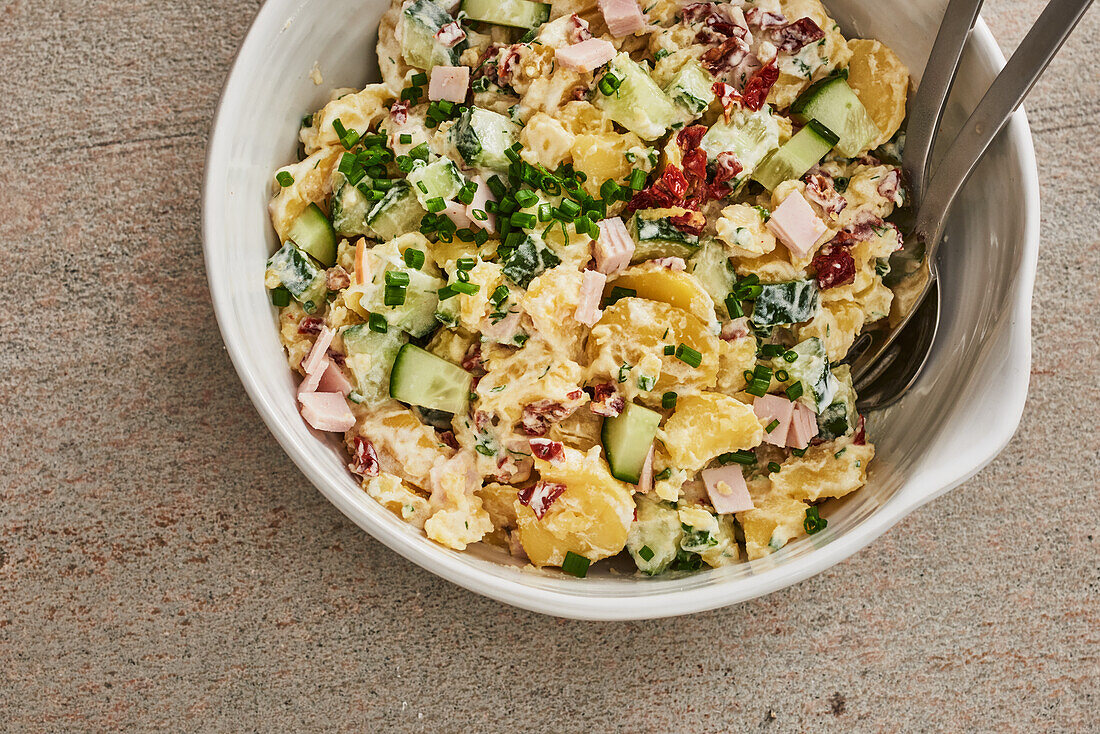 Potato and cucumber salad with turkey ham