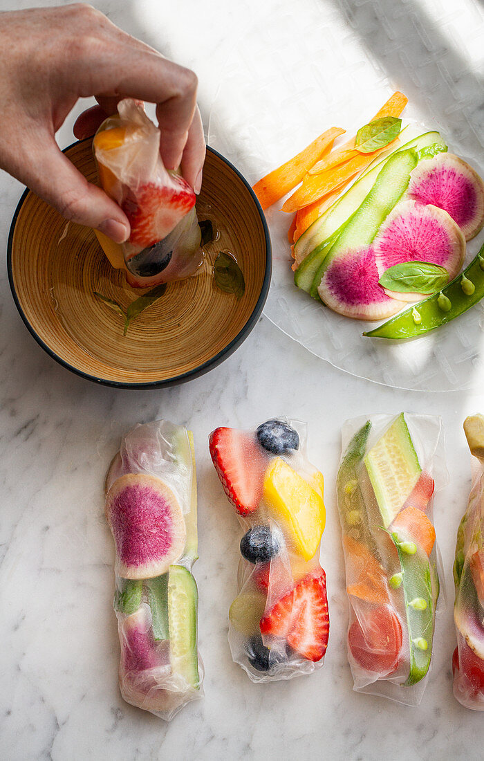 Raw fruit and vegetable spring rolls with a citrus basil dipping sauce