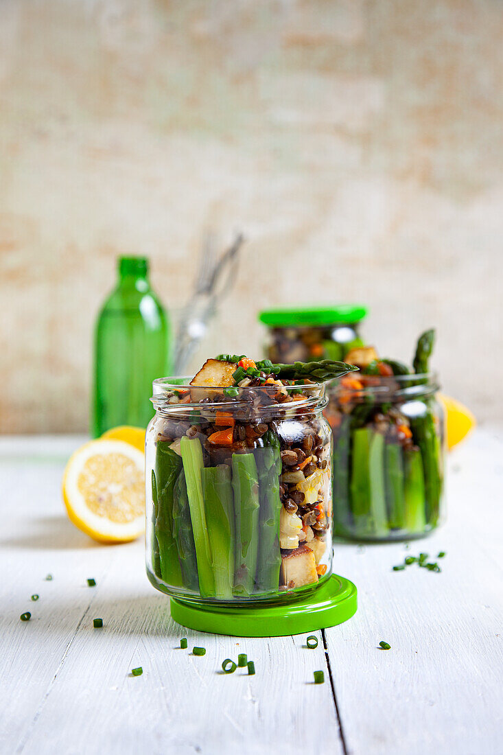 Lentil salad with green asparagus and smoked tofu in a jar