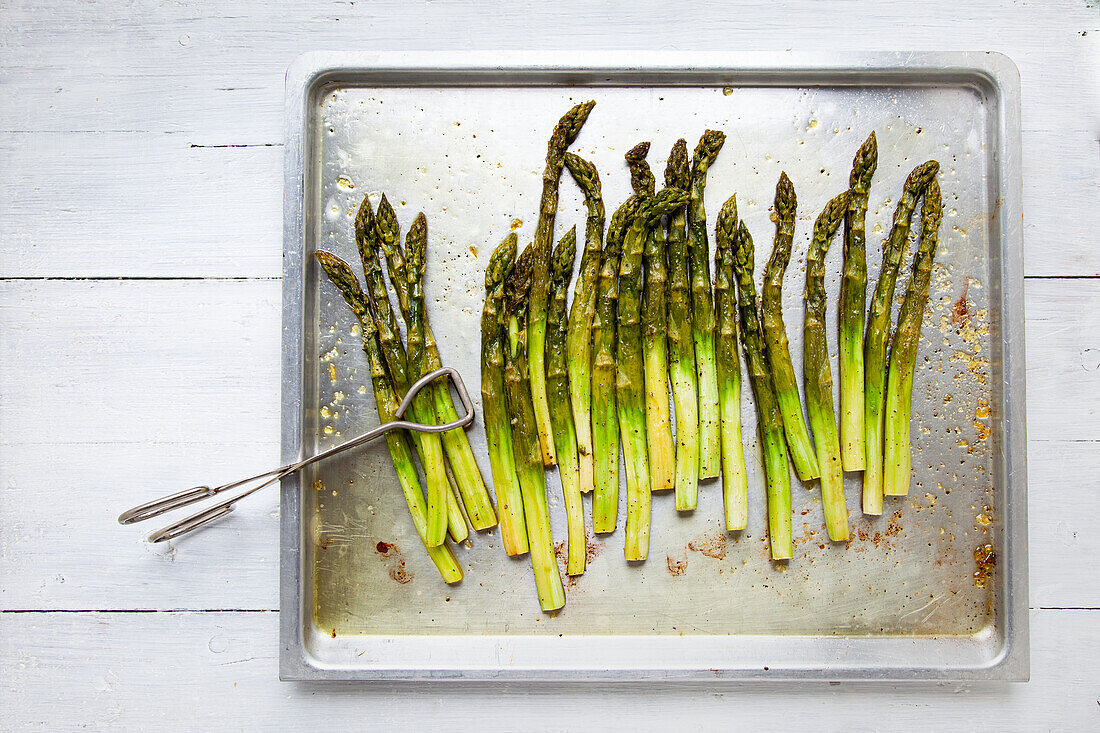 Roasted green asparagus on a baking tray