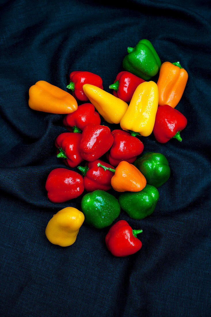 Red, green and yellow mini peppers