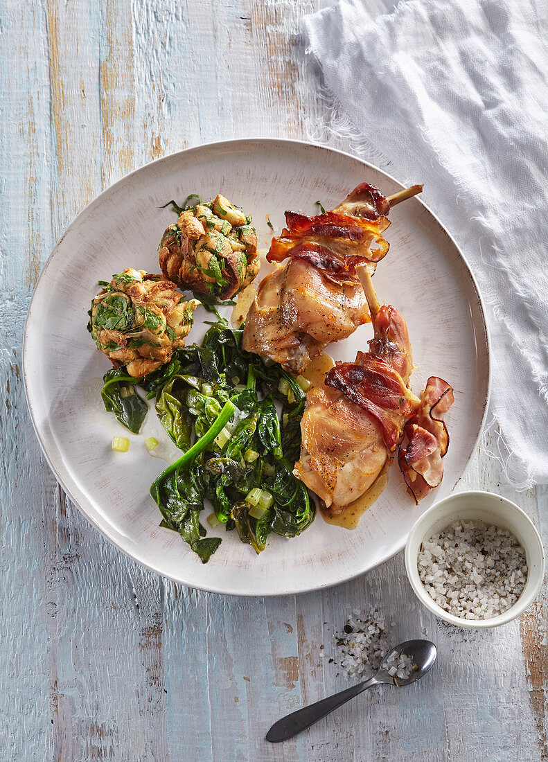 Rabbit thighs with bacon and herbal dumplings