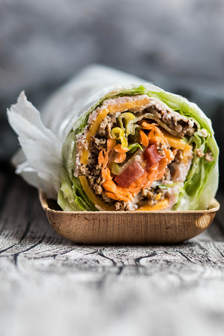 Burrito roll with lettuce, meat and vegetables
