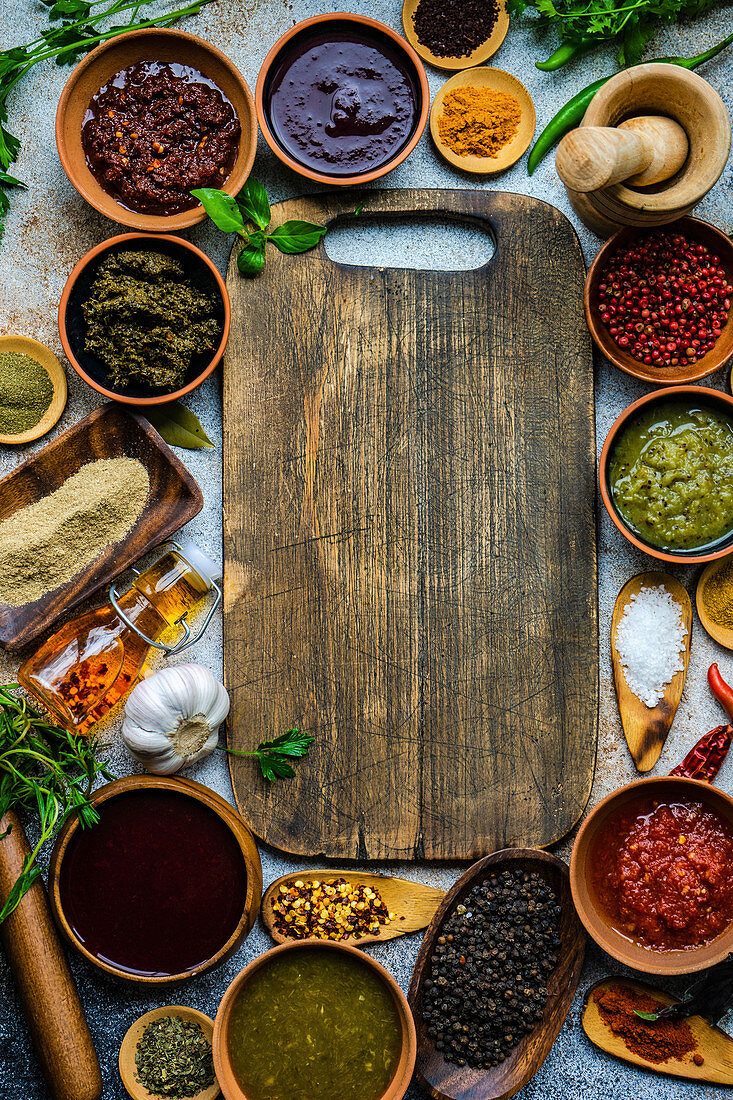 Flat lay of variety of traditional Georgian spices, sauces and herbs