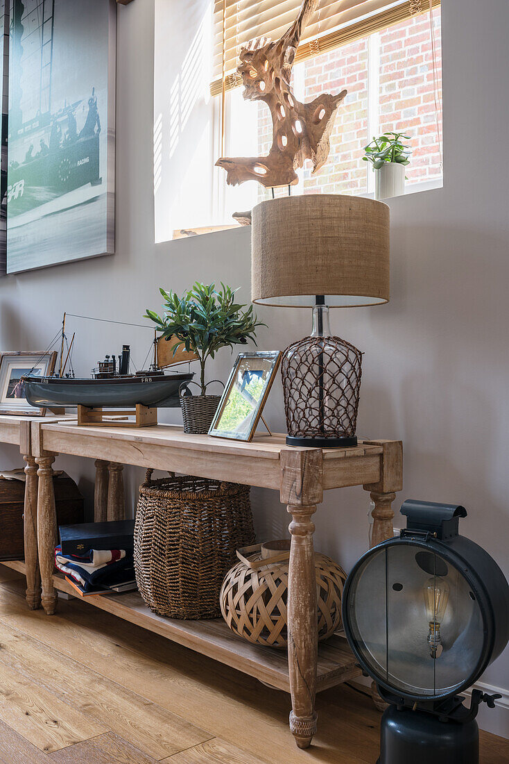 Two console tables with maritime decorations in the living room