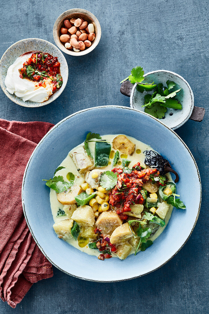 Cassava and plantain stew with corn and pepper salsa