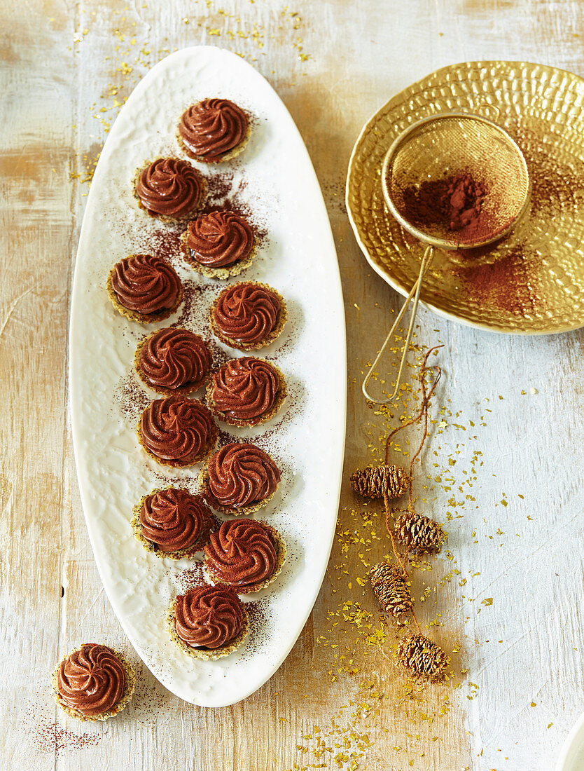 Tartlets with topsy plums and chocolate whipped cream
