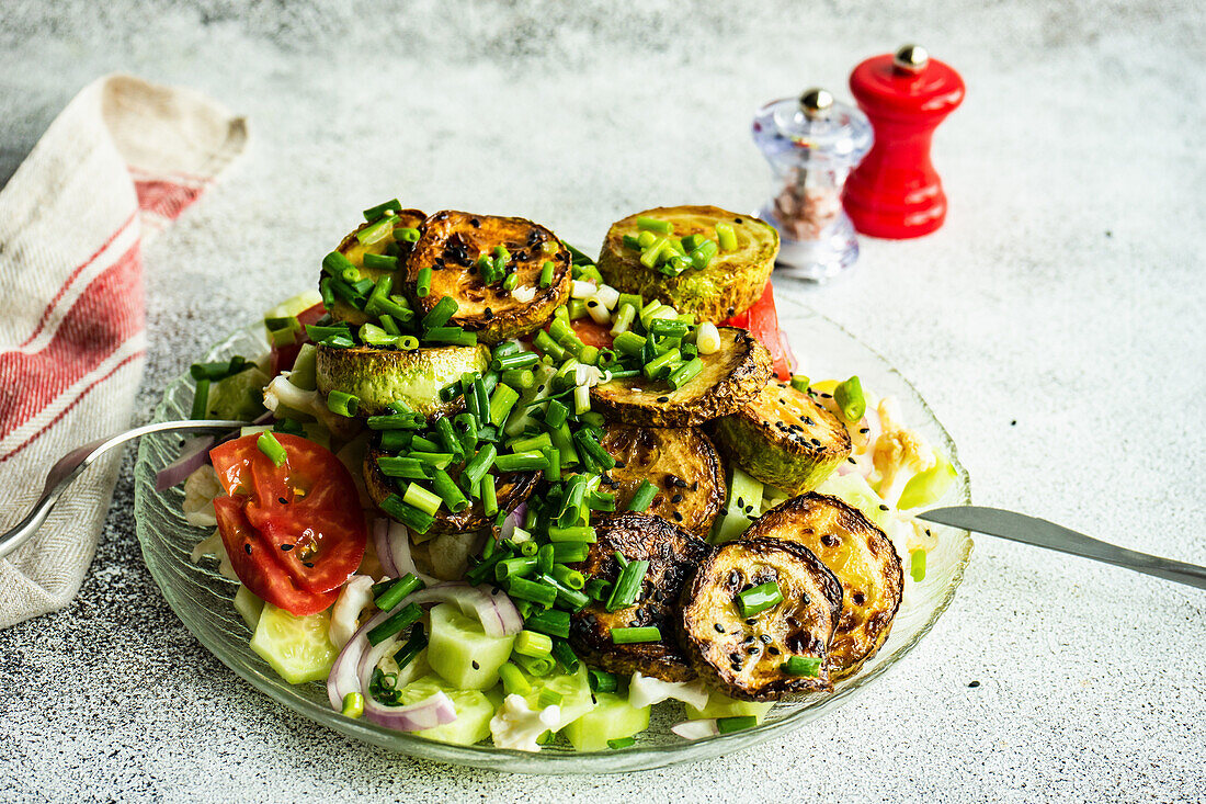 Healthy vegetable bowl with cucumber, tomato, green onion and cabbage with sesame seeds