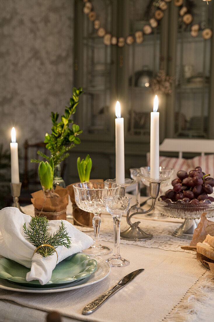 Set table in cosy dining room with winter decoration