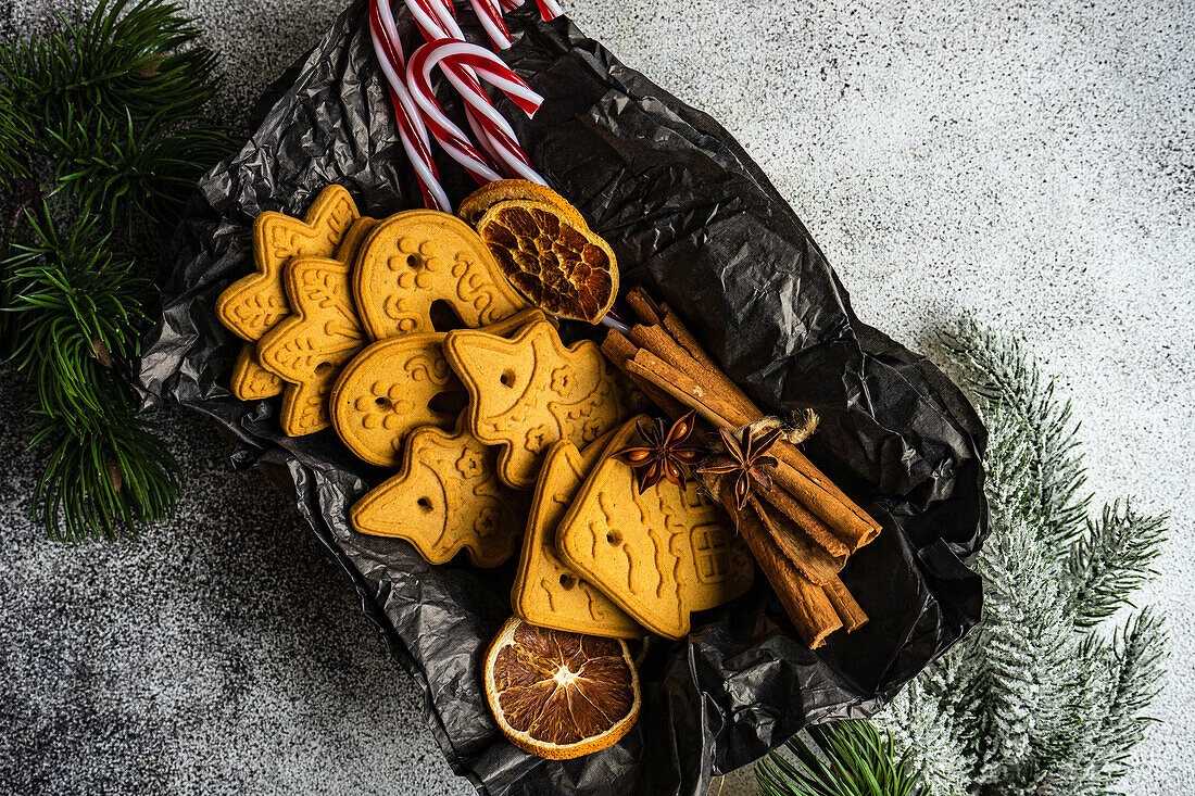 Gingerbread cookies and spices in wooden box