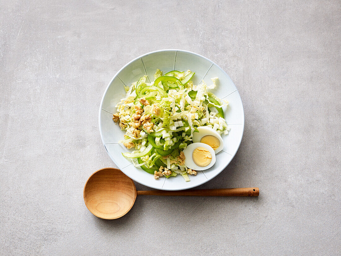 Chinese cabbage salad with walnuts, egg and apple dressing