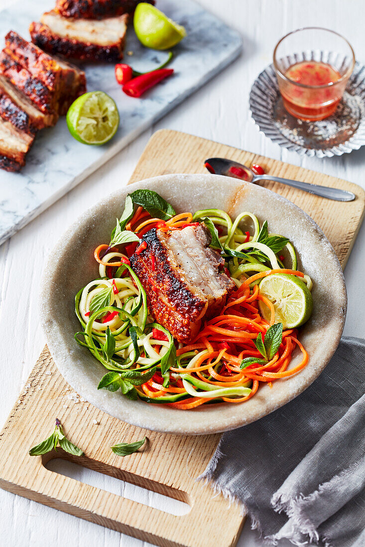 Crispy pork belly with spriralized vegetable noodle salad