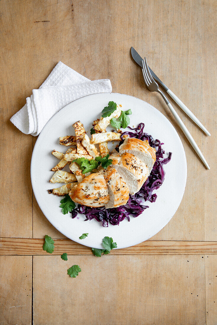 Chicken with Asian red cabbage and celery wedges