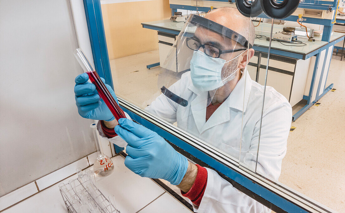 Scientist in a biosafety cabinet