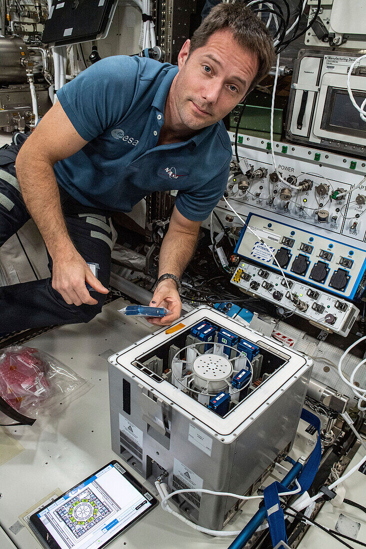 Astronaut Thomas Pesquet installing MME-2 experiment