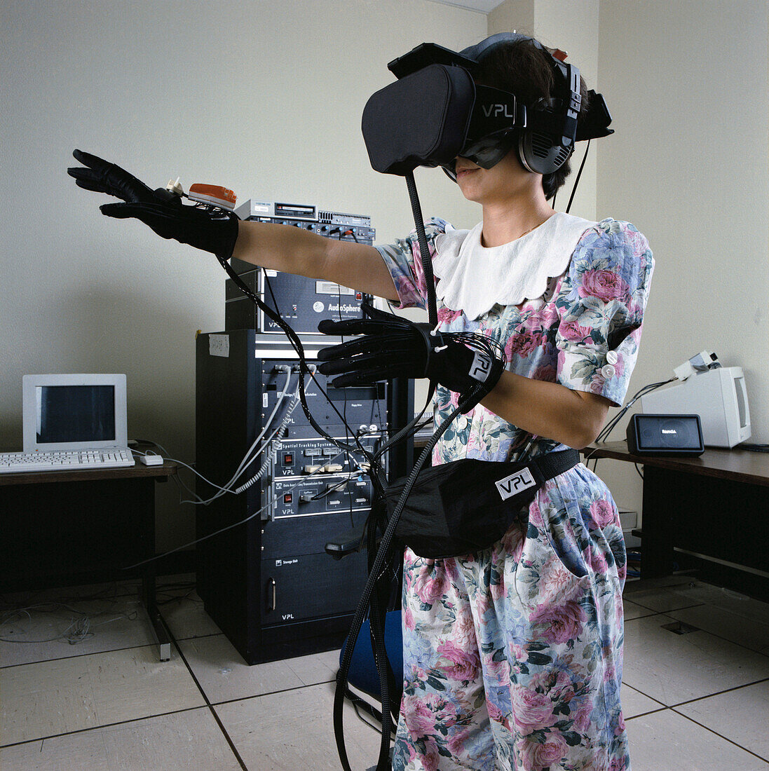 NASA researcher in VR helmet and gloves