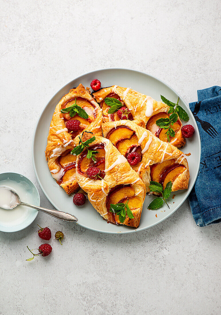 Peach puff pastry with raspberries