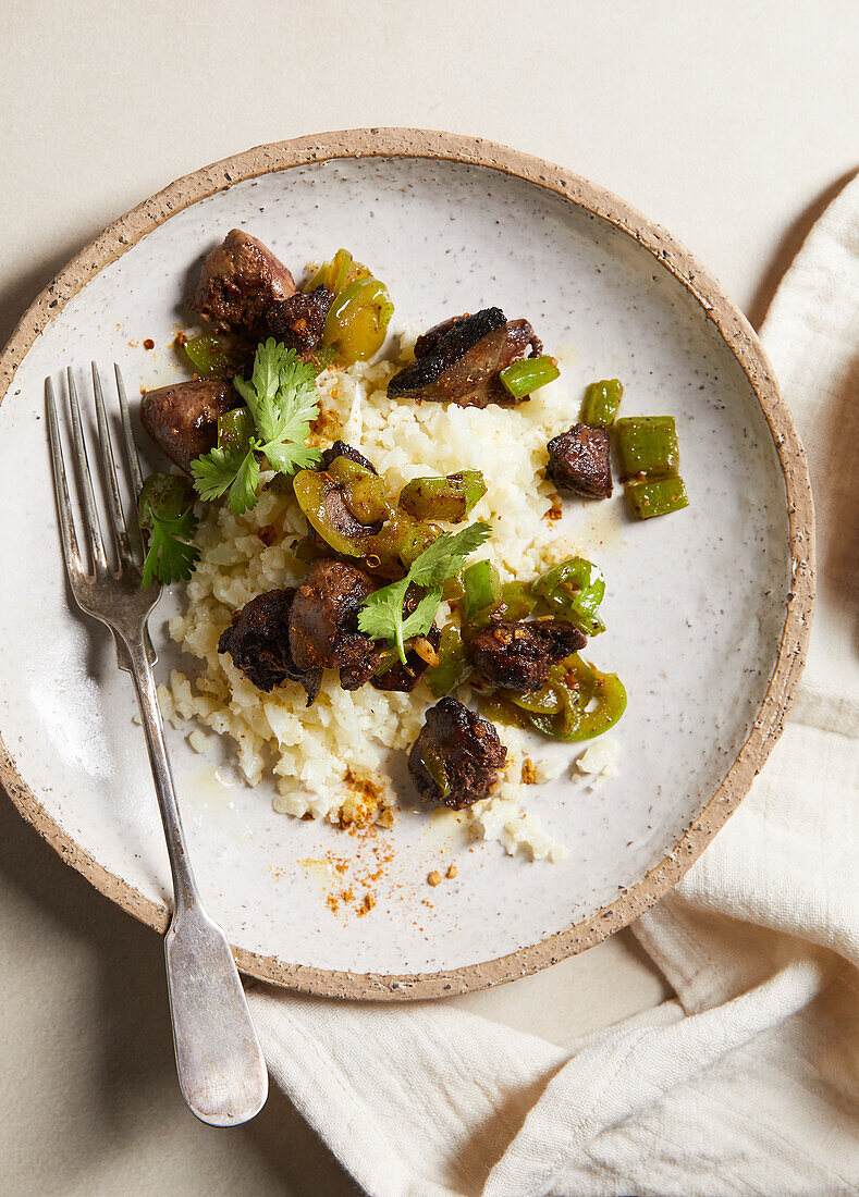 Oriental chicken liver with cauliflower, peppers and jalapeno